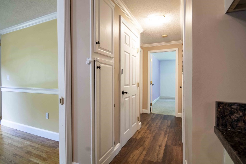 9 Elwood Road Derry, NH 03038 - Photo 20 of 42 a view of a hallway with wooden floor