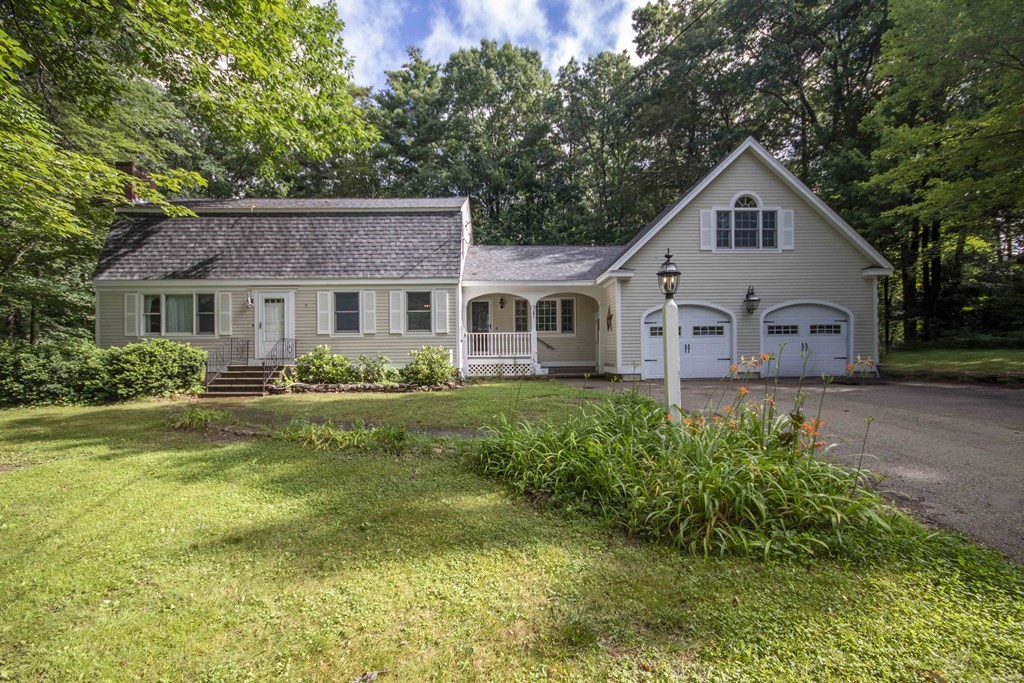 9 Elwood Road Derry, NH 03038 - Photo 2 of 42 a front view of house with yard and green space