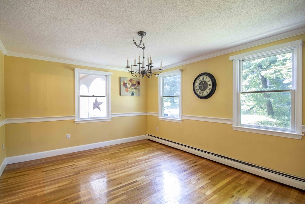 9 Elwood Road Derry, NH 03038 - Photo 25 of 42 a view of livingroom with window wooden floor and door