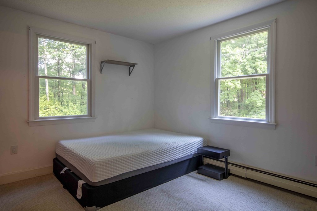 9 Elwood Road Derry, NH 03038 - Photo 31 of 42 a room with a bed and a window
