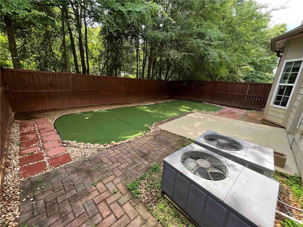 a view of backyard with sink and outdoor seating