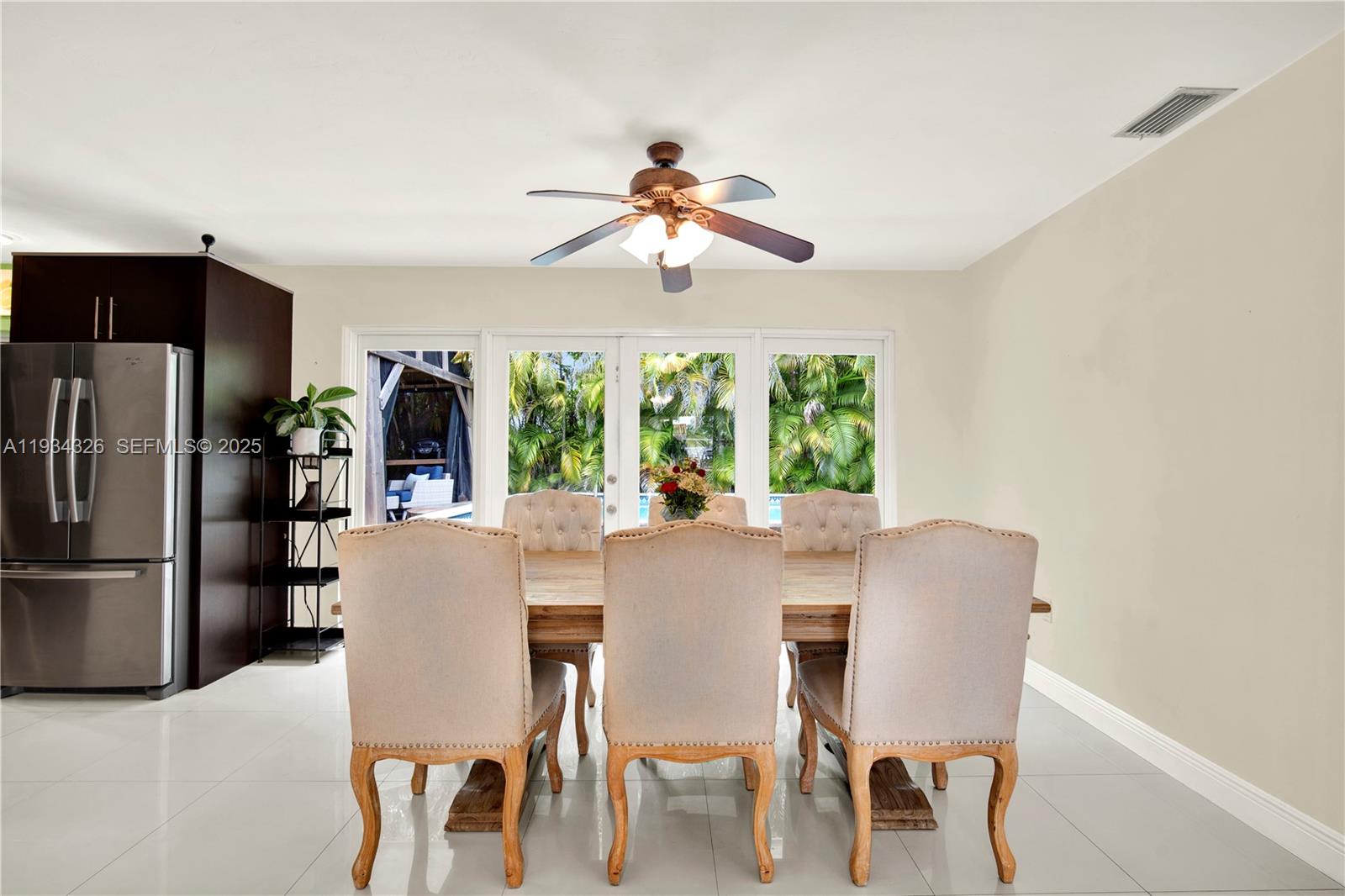 7135 Southwest 19th Terrace Miami, FL 33155 - Photo 14 of 52 a view of a dining room with furniture window and outside view