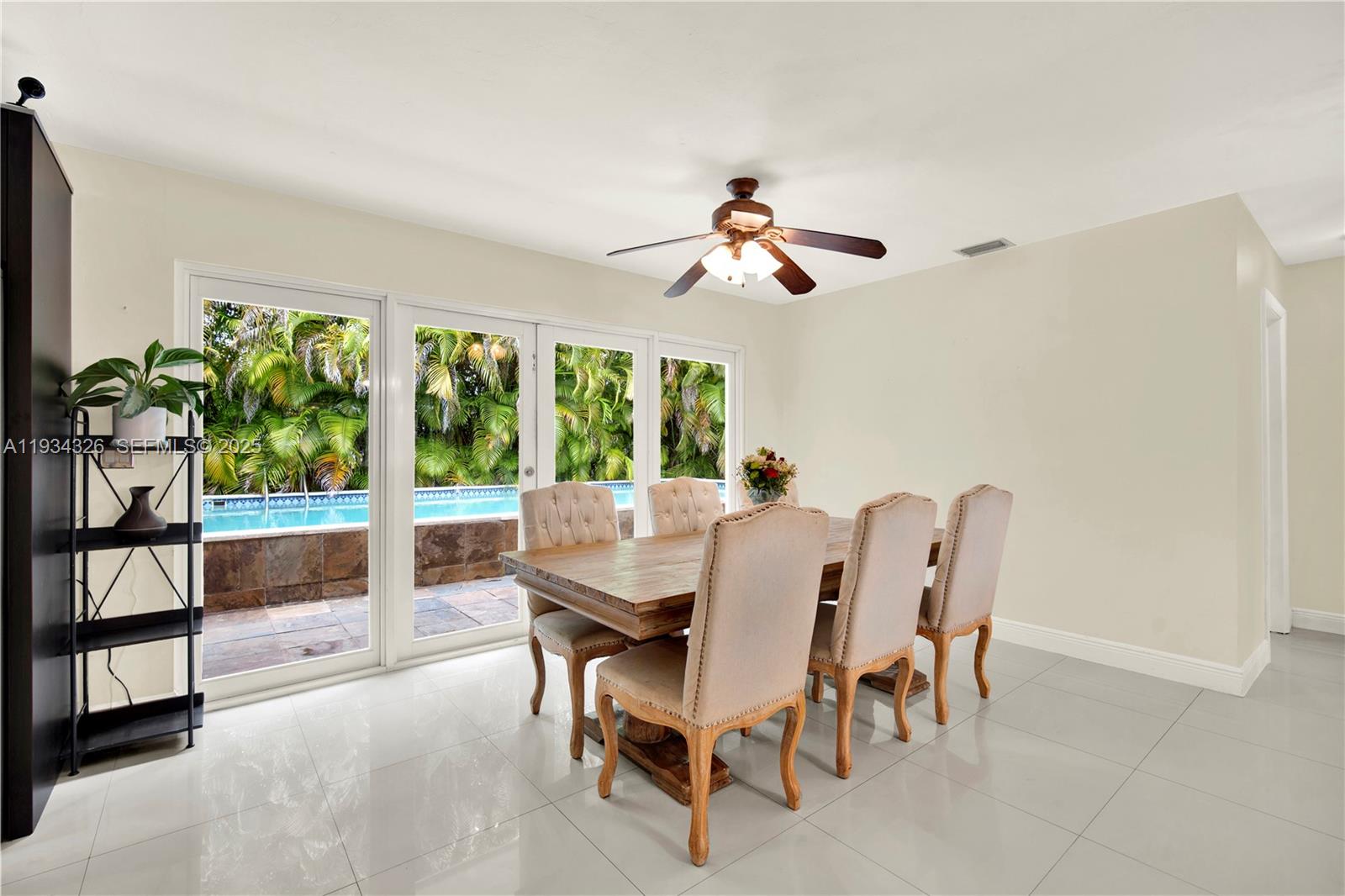 7135 Southwest 19th Terrace Miami, FL 33155 - Photo 16 of 52 a view of a dining room with furniture window and outside view