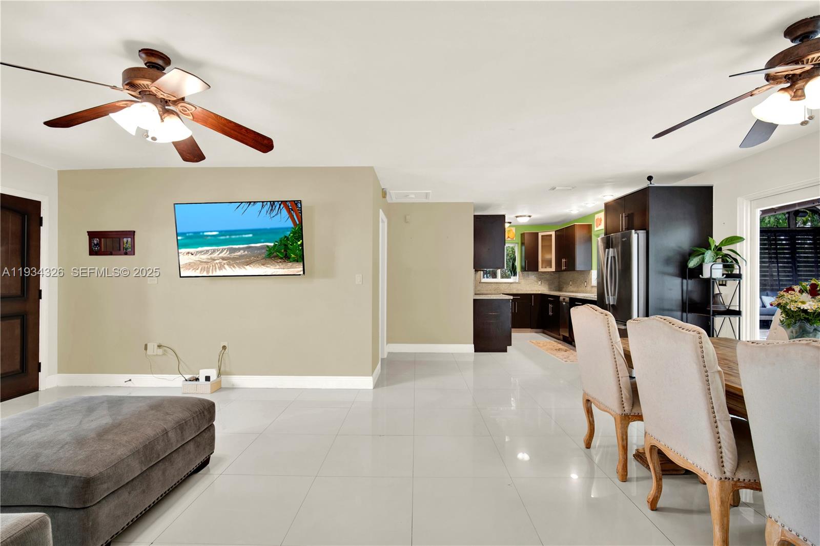 7135 Southwest 19th Terrace Miami, FL 33155 - Photo 17 of 52 a view of a livingroom with furniture and a ceiling fan