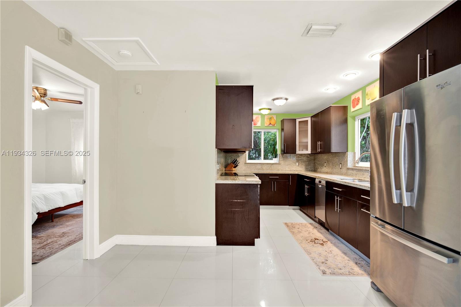 7135 Southwest 19th Terrace Miami, FL 33155 - Photo 19 of 52 a kitchen with a refrigerator and a sink