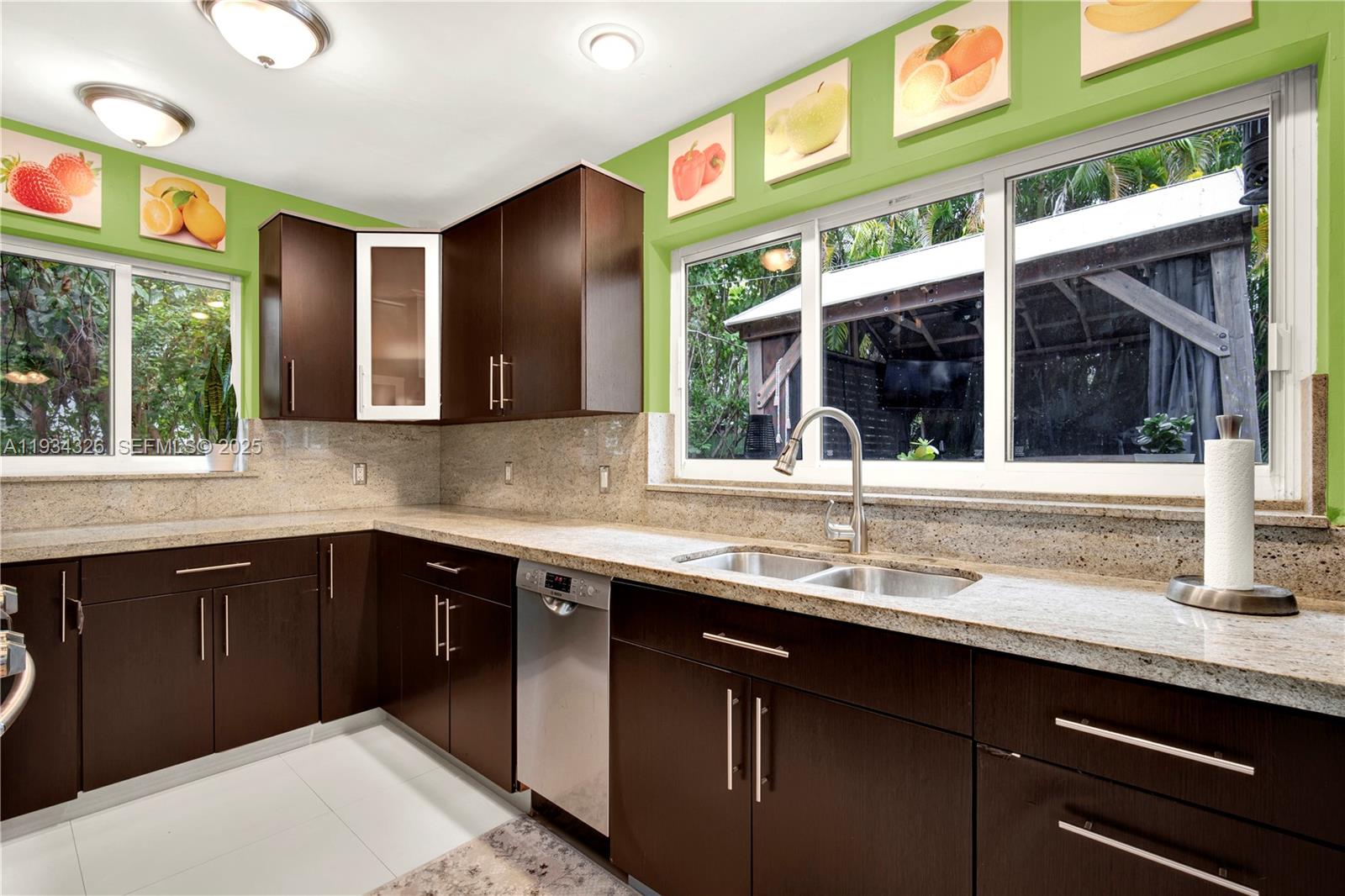 7135 Southwest 19th Terrace Miami, FL 33155 - Photo 21 of 52 a kitchen with a sink and large window