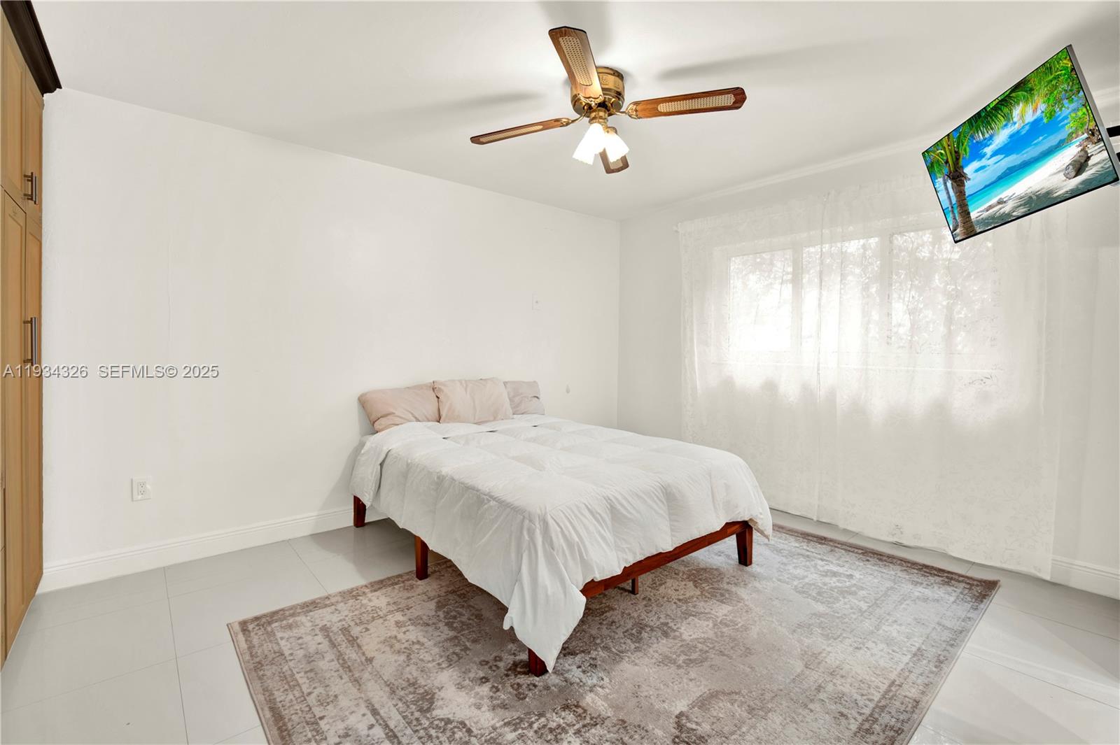 7135 Southwest 19th Terrace Miami, FL 33155 - Photo 27 of 52 a bedroom with a bed and a painting on the wall