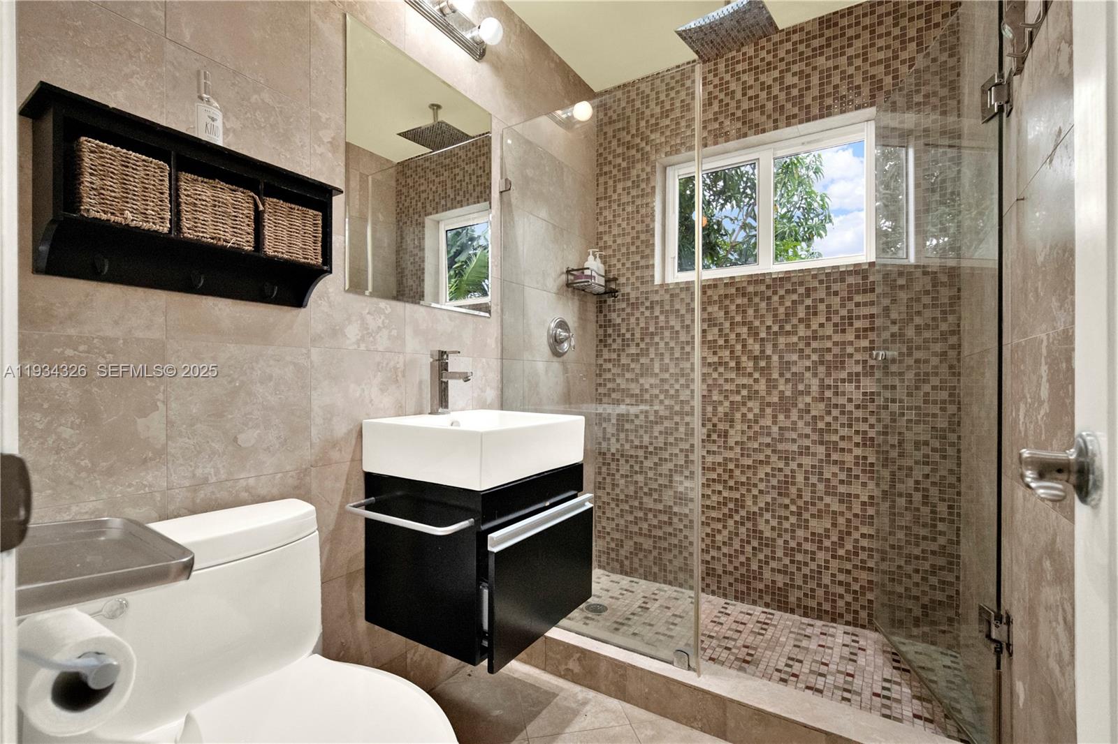 7135 Southwest 19th Terrace Miami, FL 33155 - Photo 30 of 52 a bathroom with a sink toilet and shower