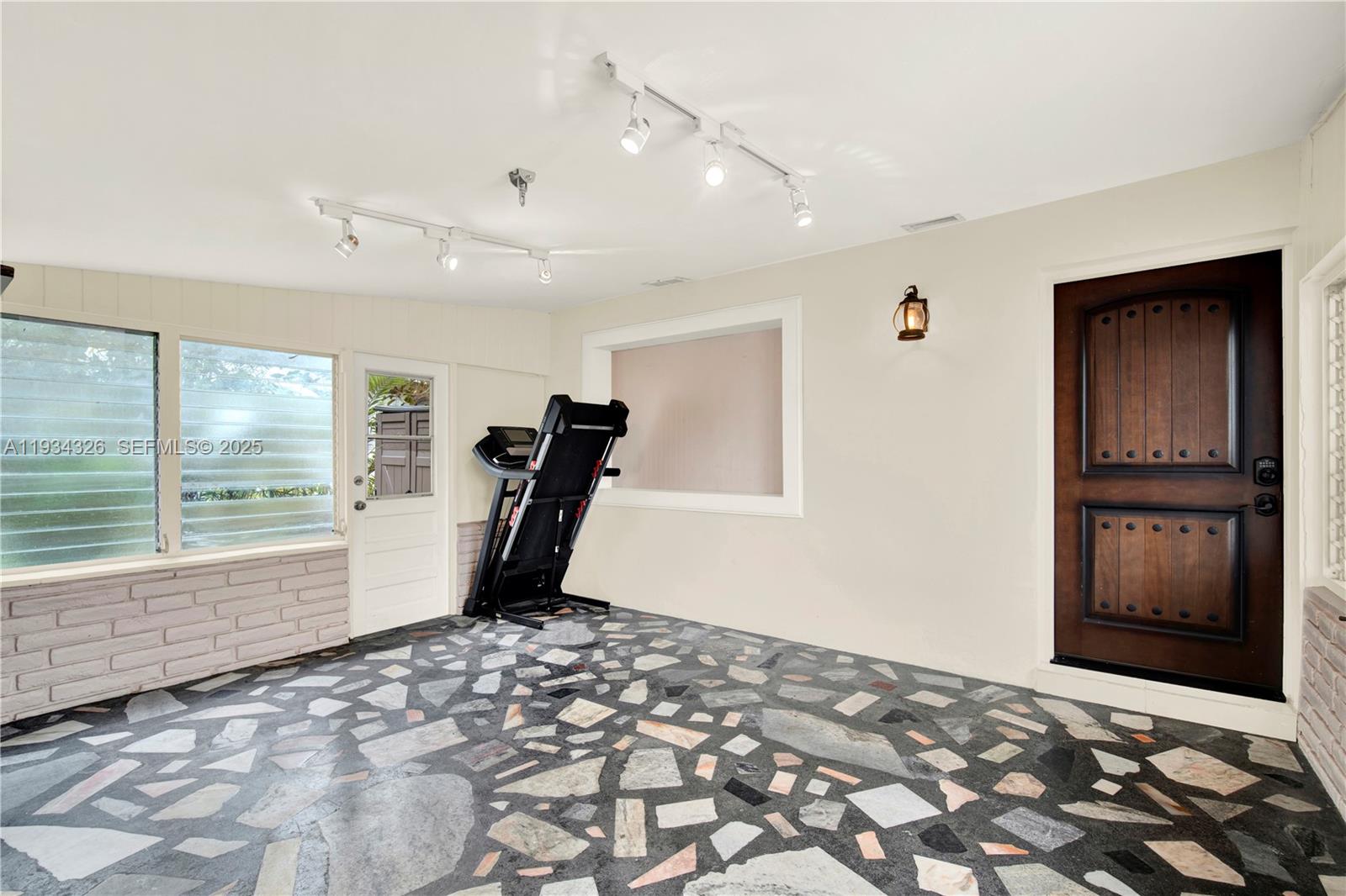 7135 Southwest 19th Terrace Miami, FL 33155 - Photo 33 of 52 a view of a room with a wooden floor and a window