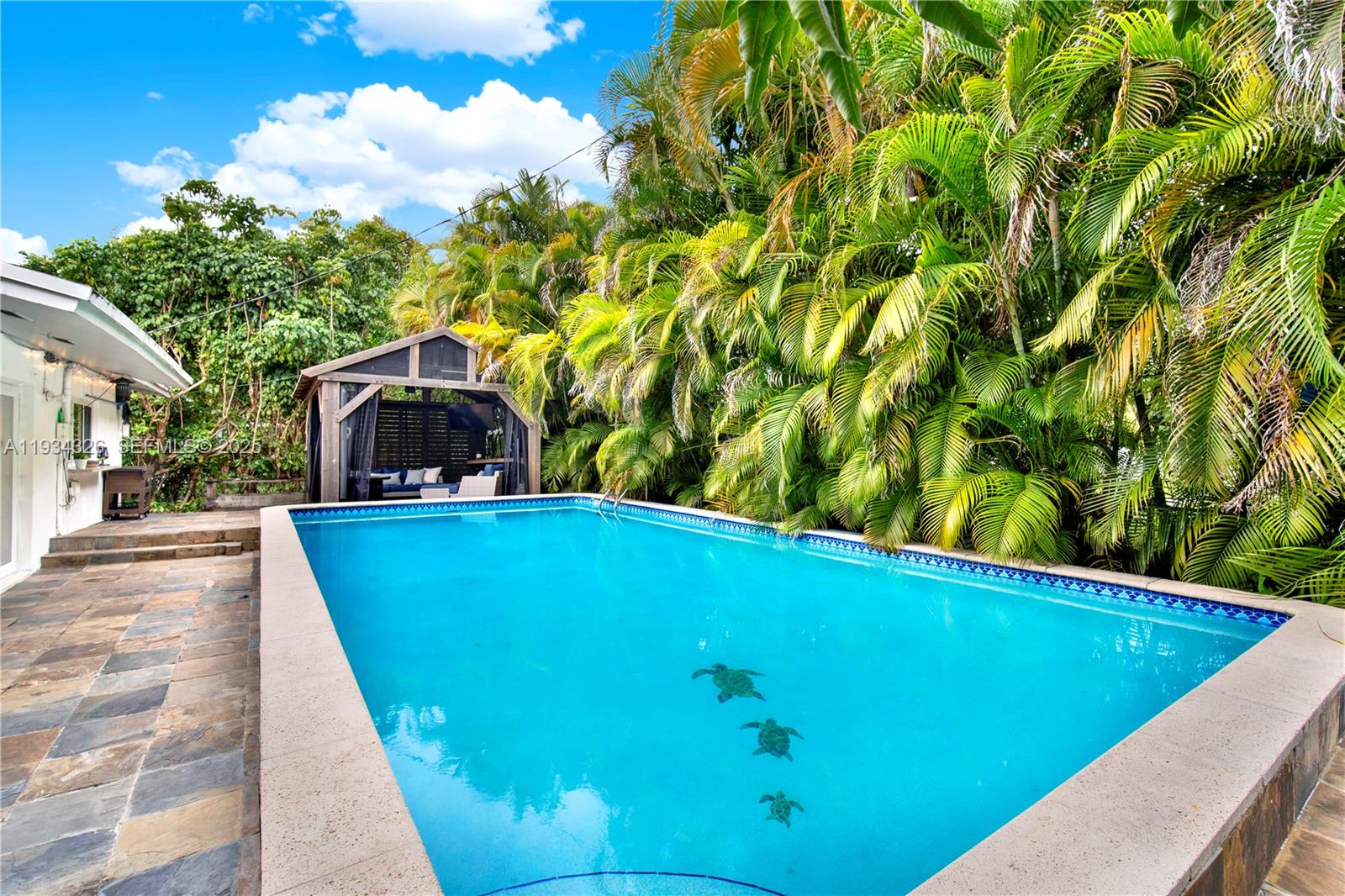 7135 Southwest 19th Terrace Miami, FL 33155 - Photo 38 of 52 a view of a swimming pool with a yard