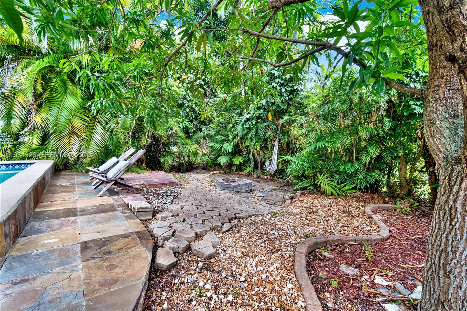 7135 Southwest 19th Terrace Miami, FL 33155 - Photo 44 of 52 a view of a yard with plants and trees