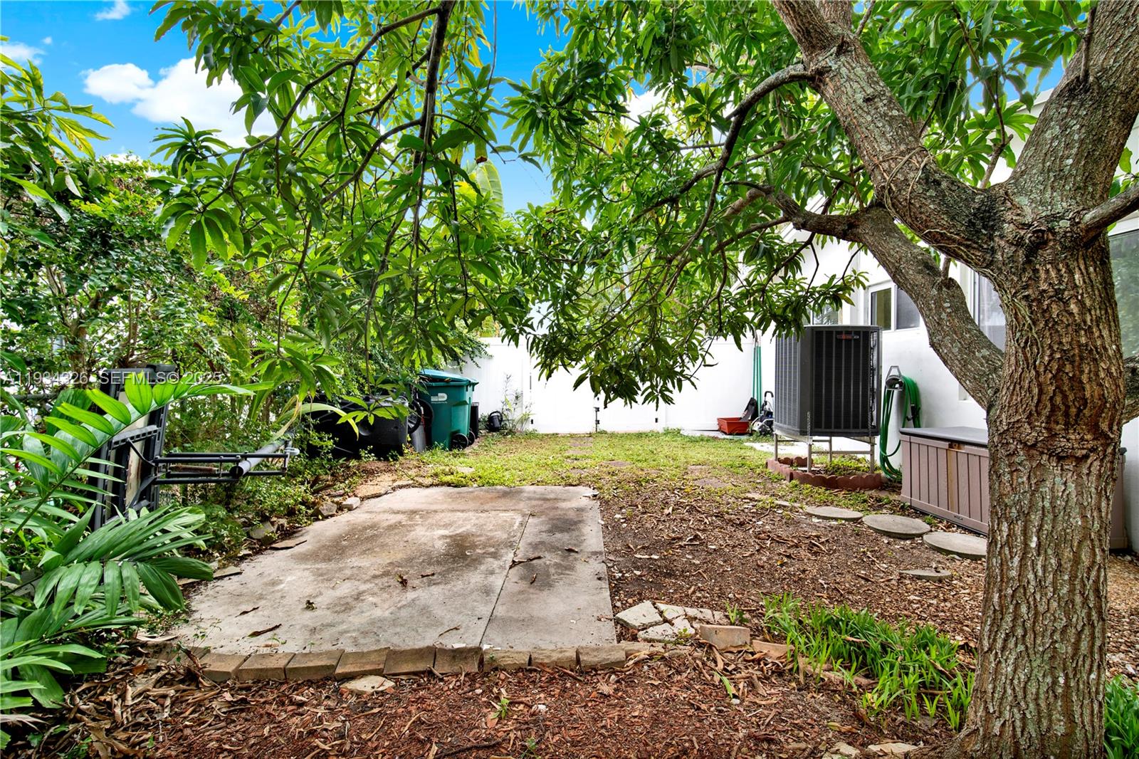 7135 Southwest 19th Terrace Miami, FL 33155 - Photo 45 of 52 a view of a yard with plants and trees