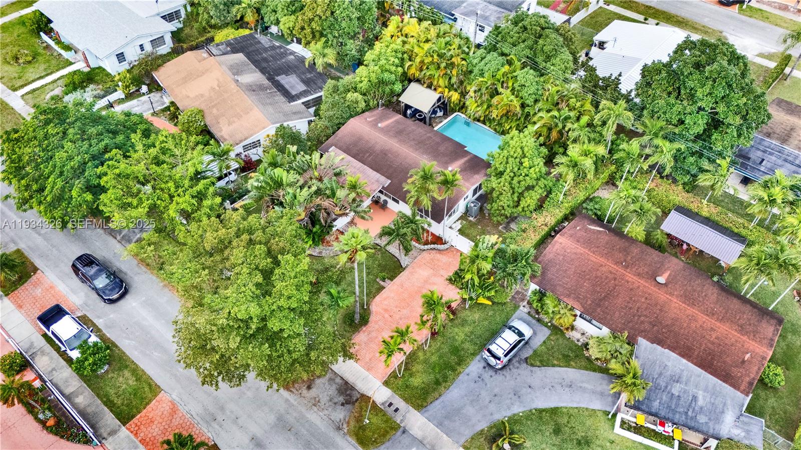 7135 Southwest 19th Terrace Miami, FL 33155 - Photo 47 of 52 an aerial view of a house with a yard and garden