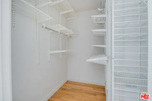 a view of an empty walk in closet