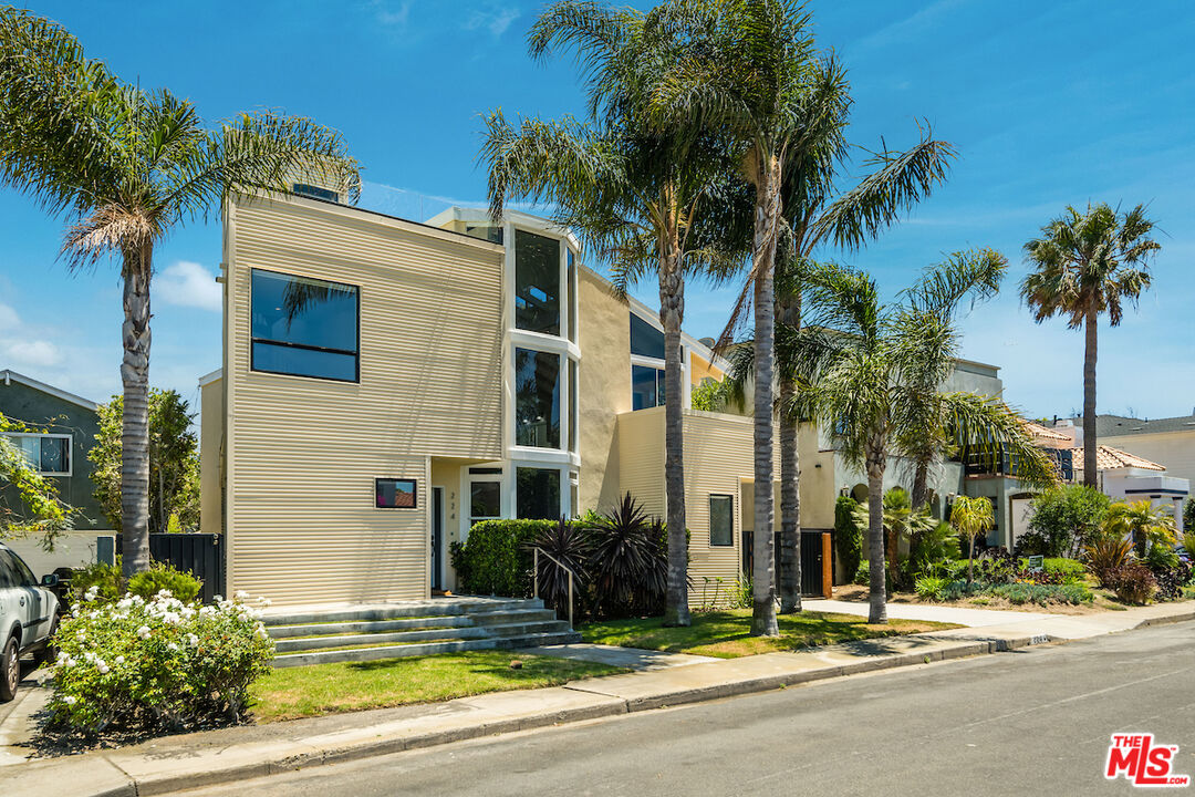 224 Sunridge Street Playa del Rey, CA 90293 - Photo 2 of 44 a view of a house with a small yard and palm trees