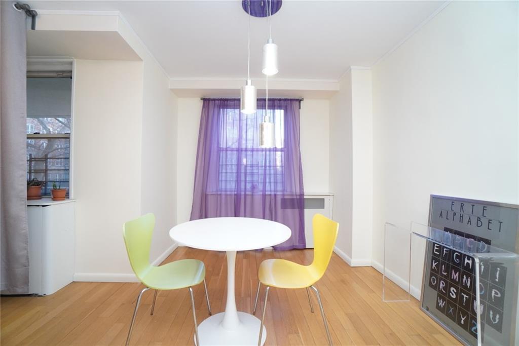 35 Seacoast Terrace, Unit 2N Brooklyn, NY 11235 - Photo 15 of 38 a view of a dining room with furniture and wooden floor