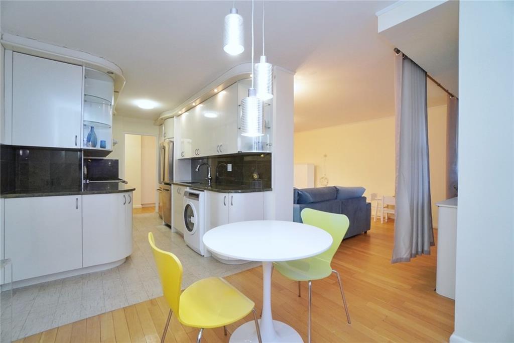 35 Seacoast Terrace, Unit 2N Brooklyn, NY 11235 - Photo 16 of 38 a view of a dining room with furniture and wooden floor