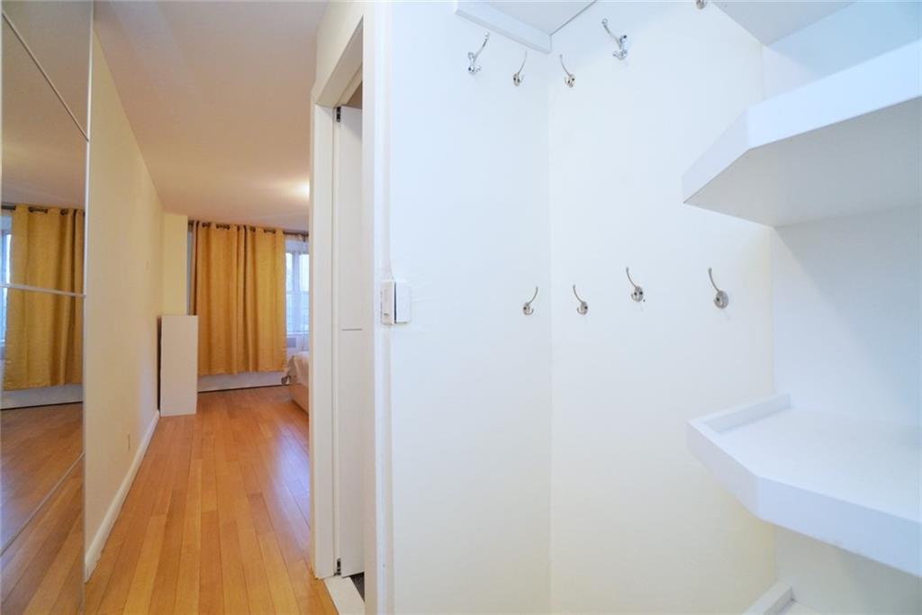 35 Seacoast Terrace, Unit 2N Brooklyn, NY 11235 - Photo 17 of 38 a view of a hallway with wooden floor