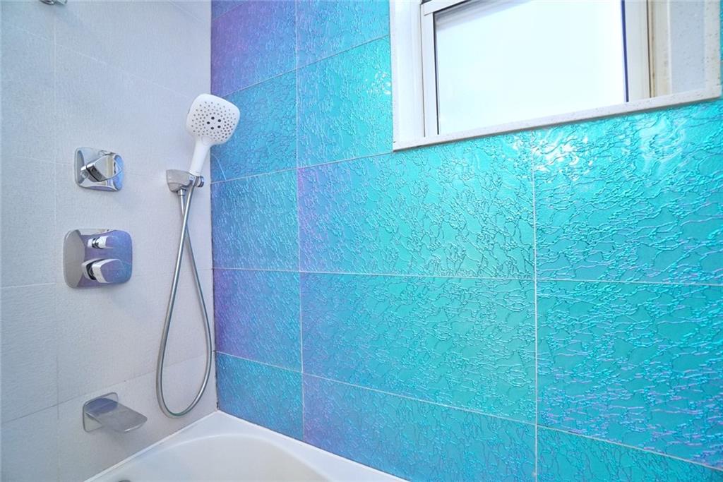 35 Seacoast Terrace, Unit 2N Brooklyn, NY 11235 - Photo 30 of 38 a bathroom with a shower