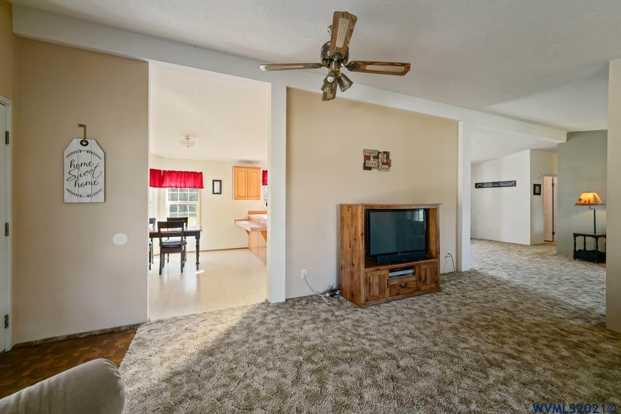 153 Hylo Road Southeast Salem, OR 97306 - Photo 11 of 41 a living room with furniture and a flat screen tv