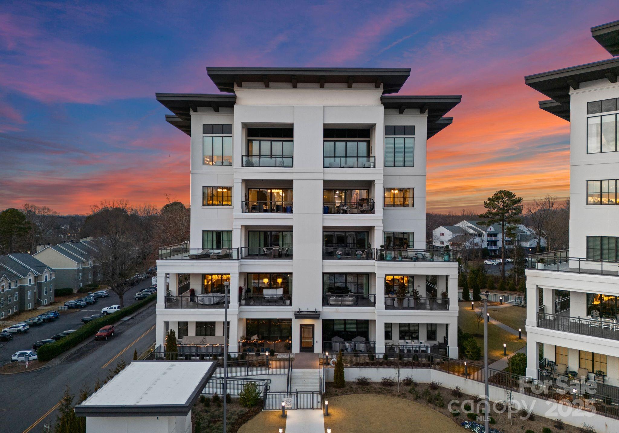 19329 Watermark Drive, Unit 551 Cornelius, NC 28031 - Photo 1 of 25 a front view of a multi story building