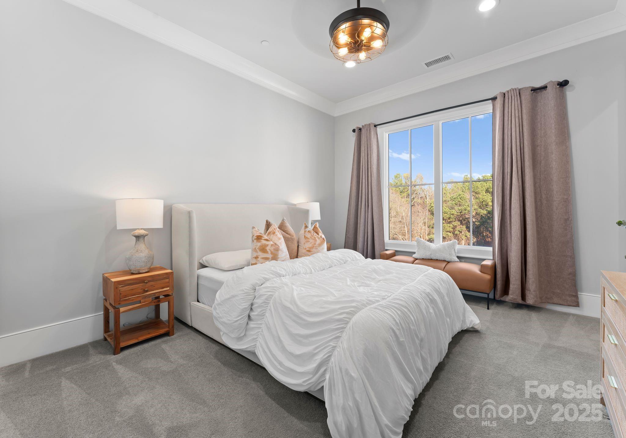 19329 Watermark Drive, Unit 551 Cornelius, NC 28031 - Photo 20 of 25 a bedroom with a bed and a window