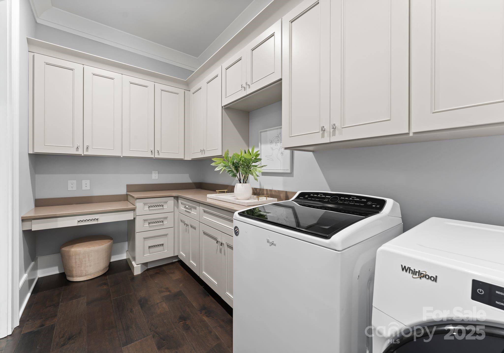 19329 Watermark Drive, Unit 551 Cornelius, NC 28031 - Photo 21 of 25 a kitchen with granite countertop white cabinets and white appliances