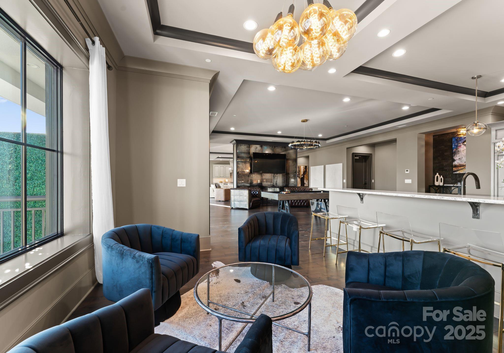19329 Watermark Drive, Unit 551 Cornelius, NC 28031 - Photo 8 of 25 a living room with furniture and a large window