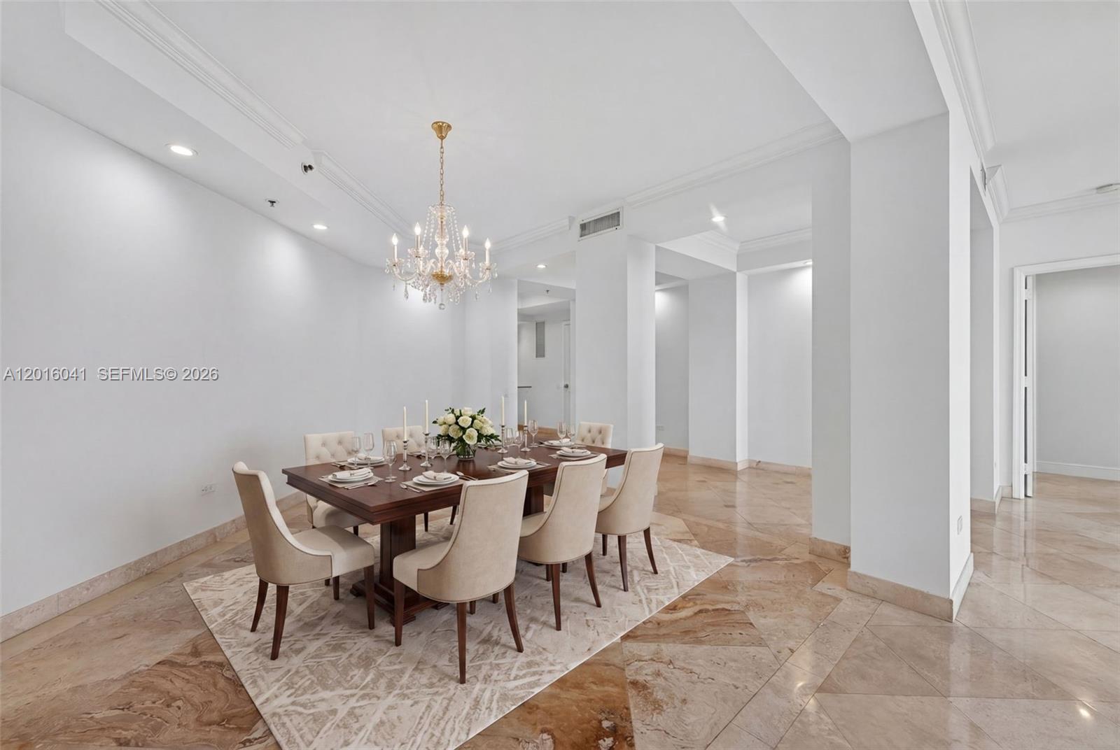 808 Brickell Key Drive, Unit 3304 Miami, FL 33131 - Photo 16 of 70 a view of a dining room with furniture and chandelier