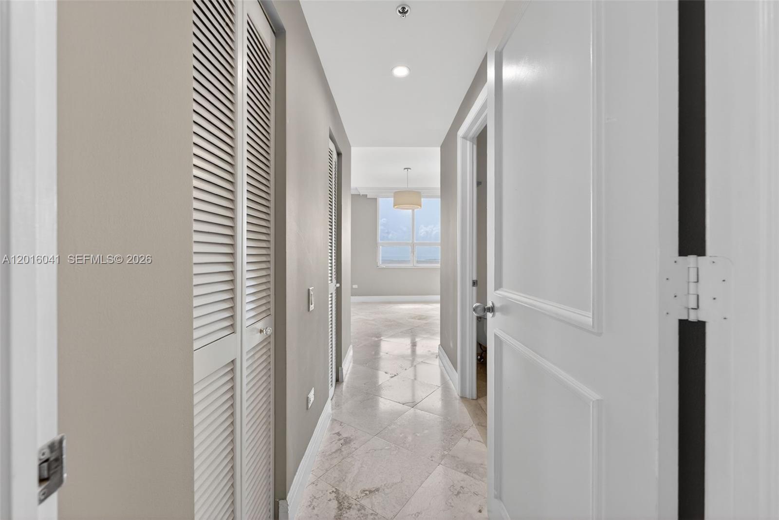 808 Brickell Key Drive, Unit 3304 Miami, FL 33131 - Photo 23 of 70 a view of a hallway with a white walls