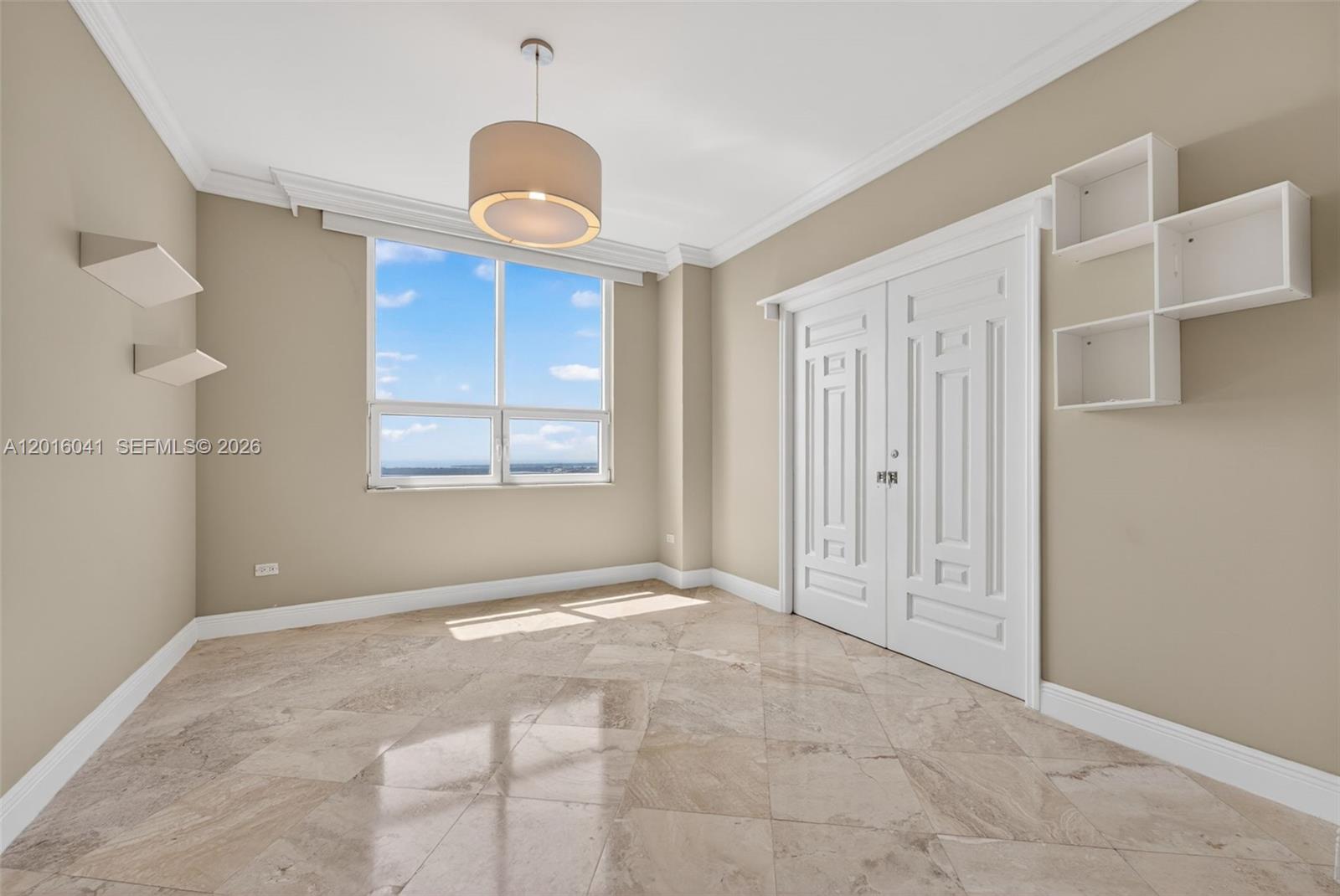 808 Brickell Key Drive, Unit 3304 Miami, FL 33131 - Photo 26 of 70 a view of an empty room with window and wooden floor