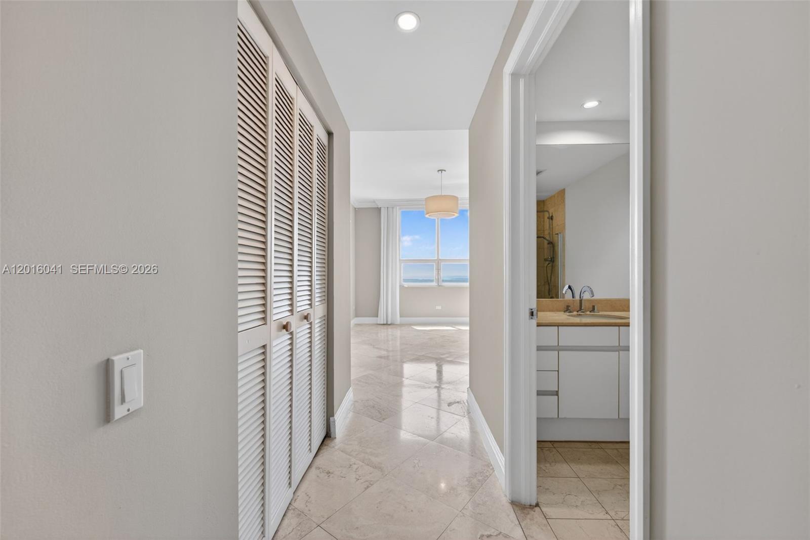 808 Brickell Key Drive, Unit 3304 Miami, FL 33131 - Photo 36 of 70 a view of a bathroom from a hallway