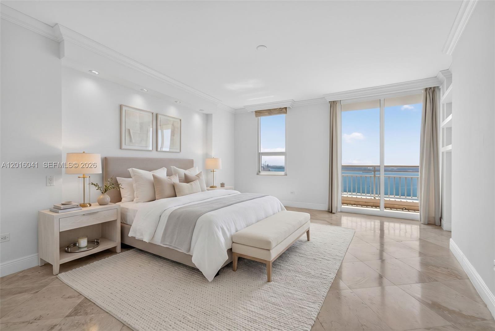 808 Brickell Key Drive, Unit 3304 Miami, FL 33131 - Photo 41 of 70 a spacious bedroom with a bed and a large window