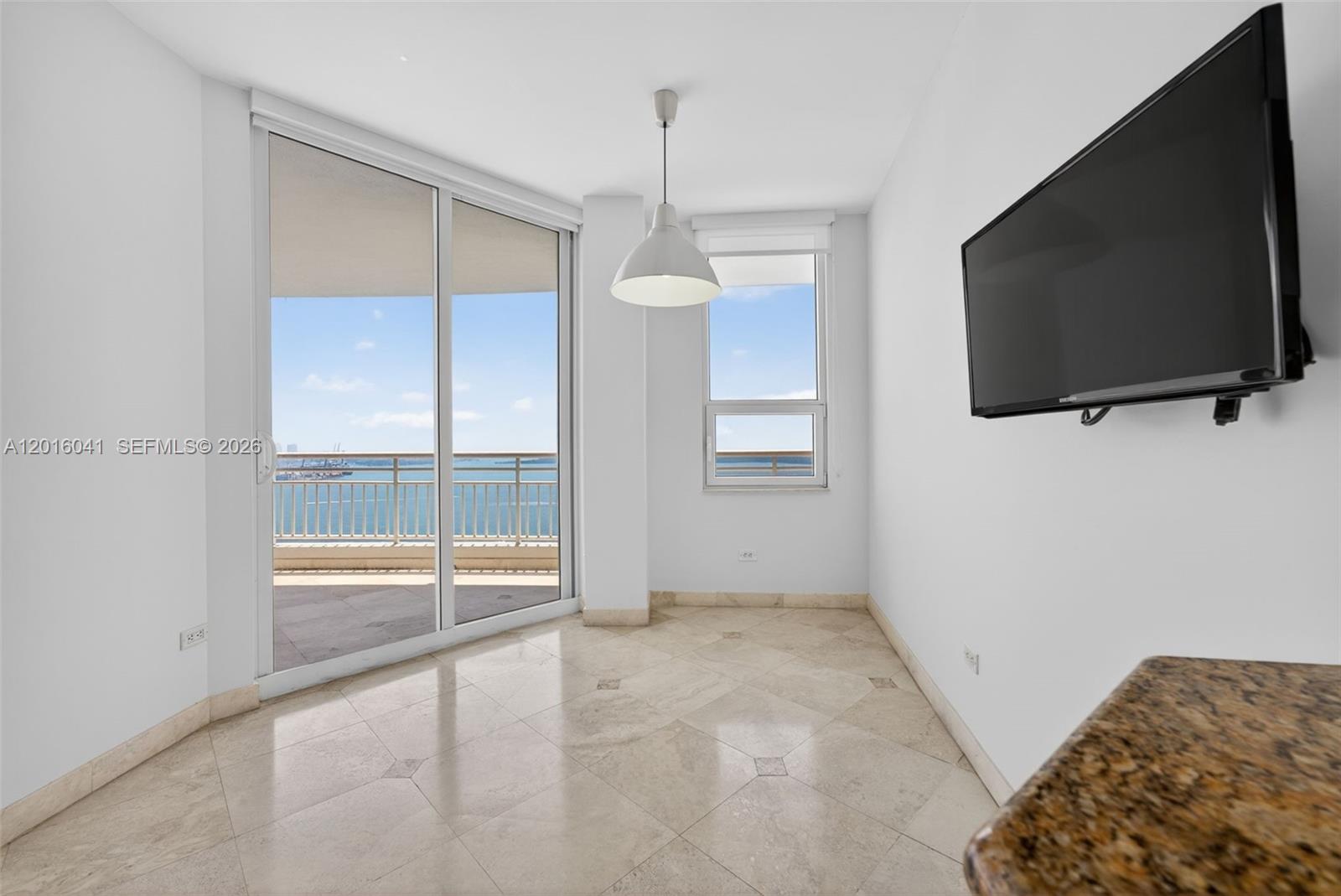 808 Brickell Key Drive, Unit 3304 Miami, FL 33131 - Photo 46 of 70 a view of a livingroom with a flat screen tv