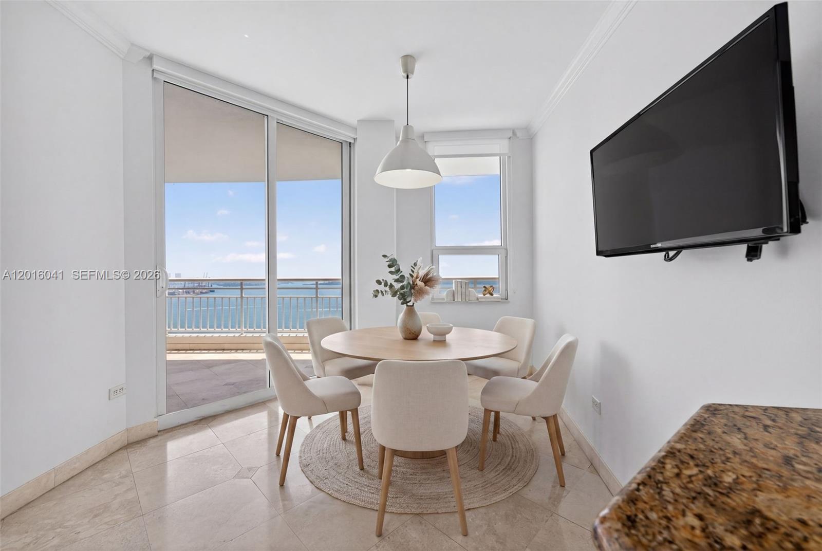 808 Brickell Key Drive, Unit 3304 Miami, FL 33131 - Photo 47 of 70 a dining room with furniture and window