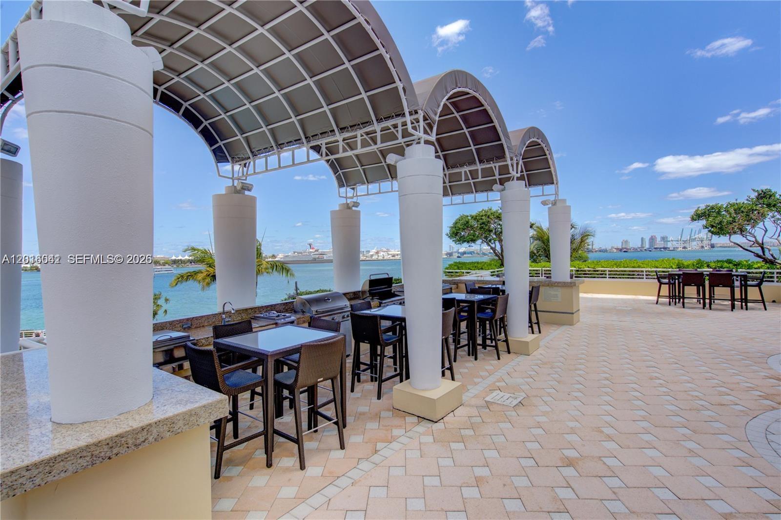 808 Brickell Key Drive, Unit 3304 Miami, FL 33131 - Photo 58 of 70 a view of a dining room with furniture window and outside view