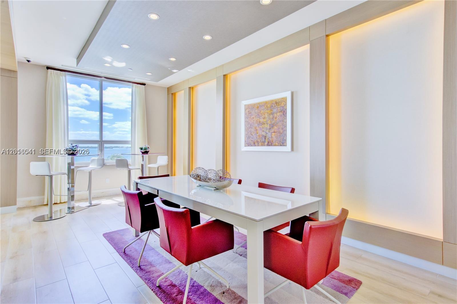 808 Brickell Key Drive, Unit 3304 Miami, FL 33131 - Photo 60 of 70 a view of a dining room with furniture window and wooden floor