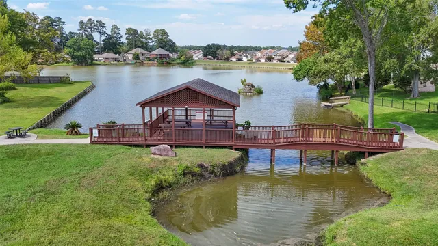 a swimming pool with outdoor seating and yard