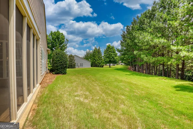 a view of swimming pool from a yard