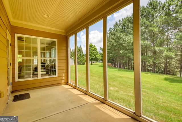 a view of a room with a large window