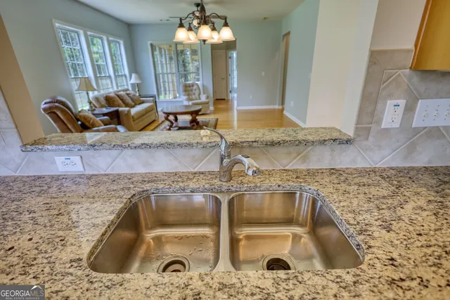 a kitchen with granite countertop a sink and a granite counter tops