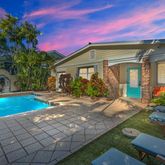 a view of a house with basketball court