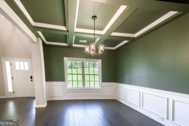 a view of an entryway with wooden floor