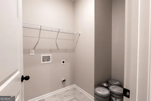 a bathroom with a toilet and a shower curtain