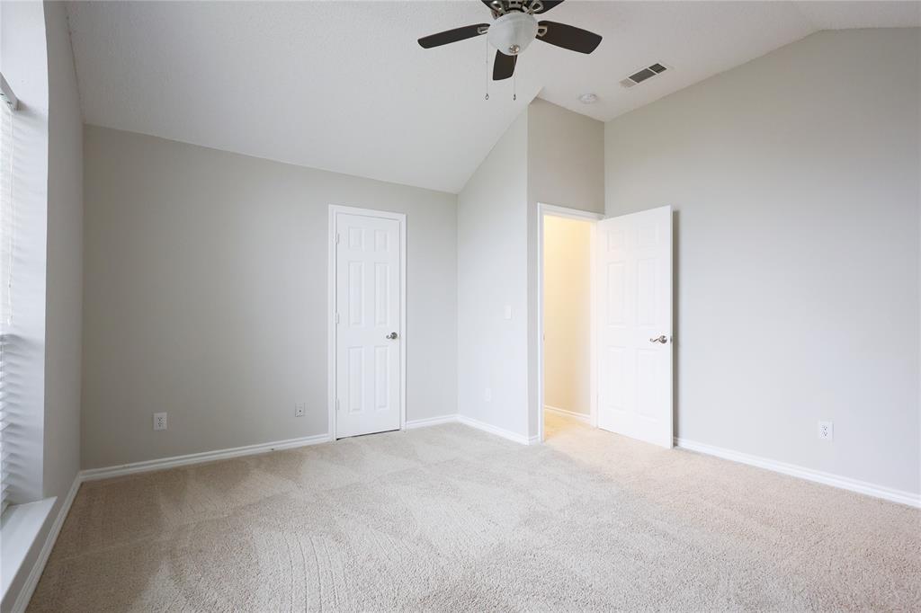 8112 Dock Street Frisco, TX 75035 - Photo 28 of 34 an empty room with a ceiling fan and a window