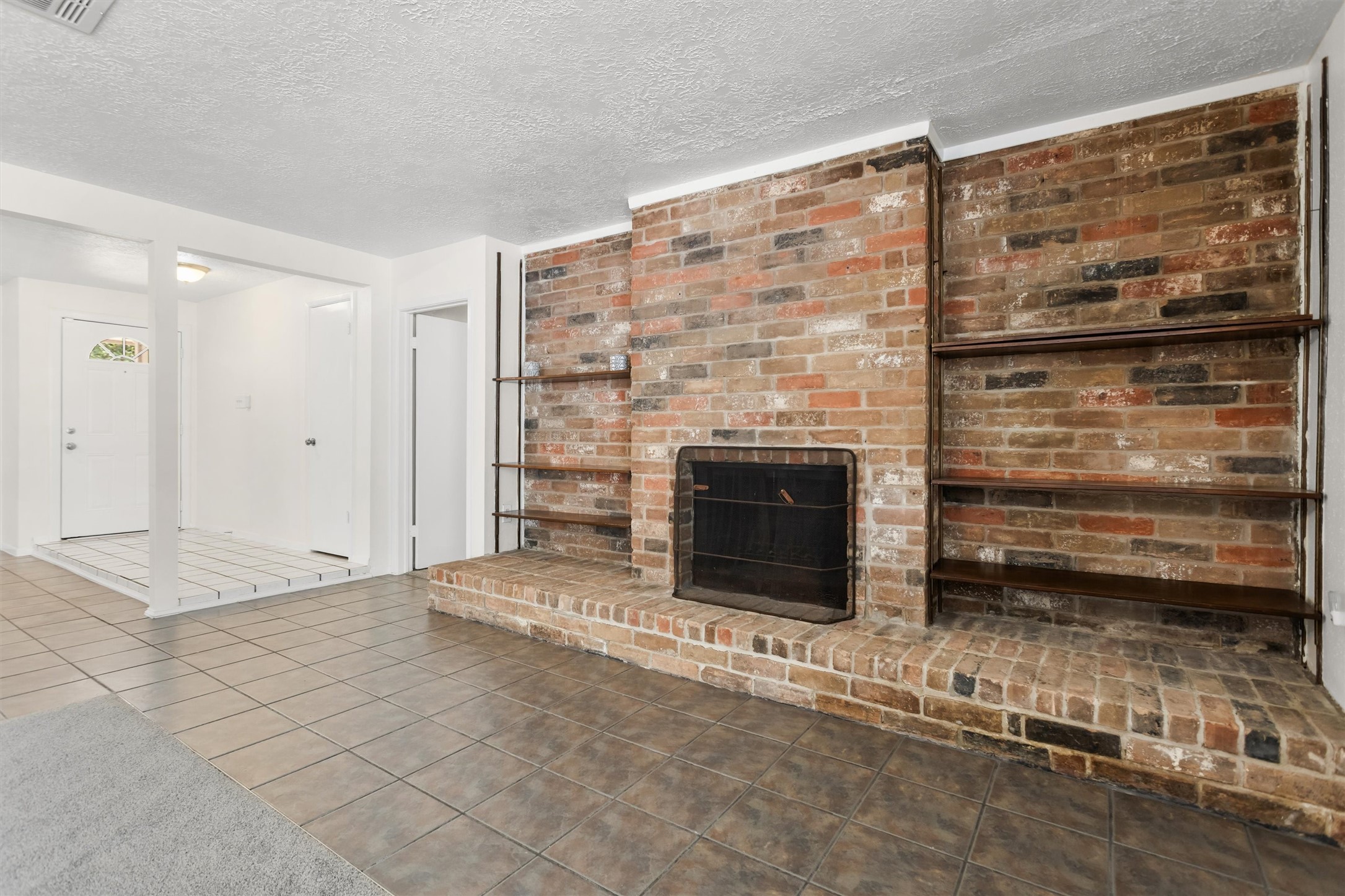 11319 Rousseau Drive Houston, TX 77065 - Photo 5 of 29 The home features an all brick, real wood burning fireplace.