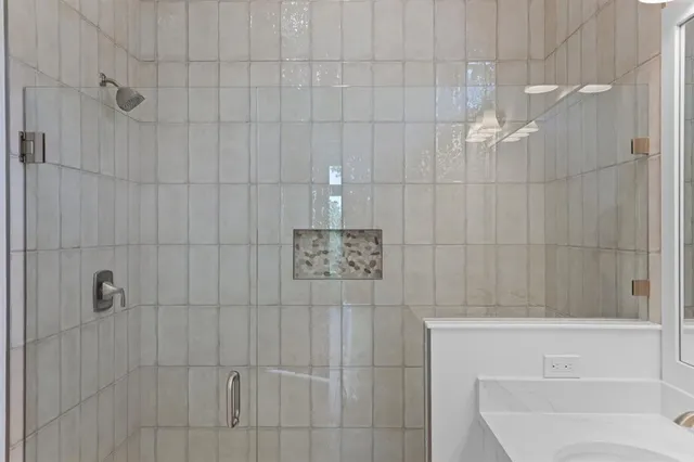 a bathroom with a shower and a toilet