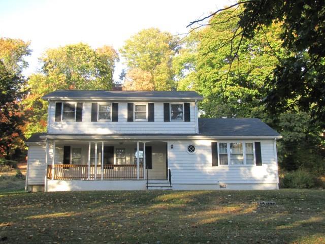 243 Greens Farms Road Westport, CT 06880 - Photo 1 of 1 a front view of a house with a garden