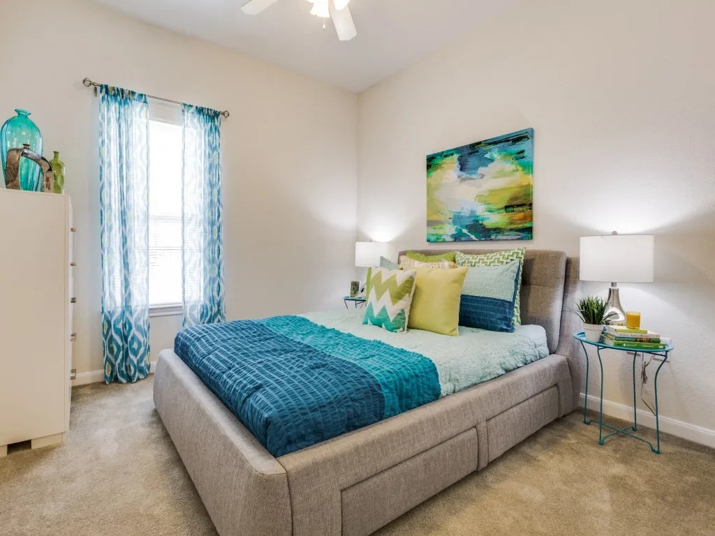 14722 Nacogdoches Road, Unit 4308 San Antonio, TX 78247 - Photo 18 of 22 a bedroom with a bed and a dresser