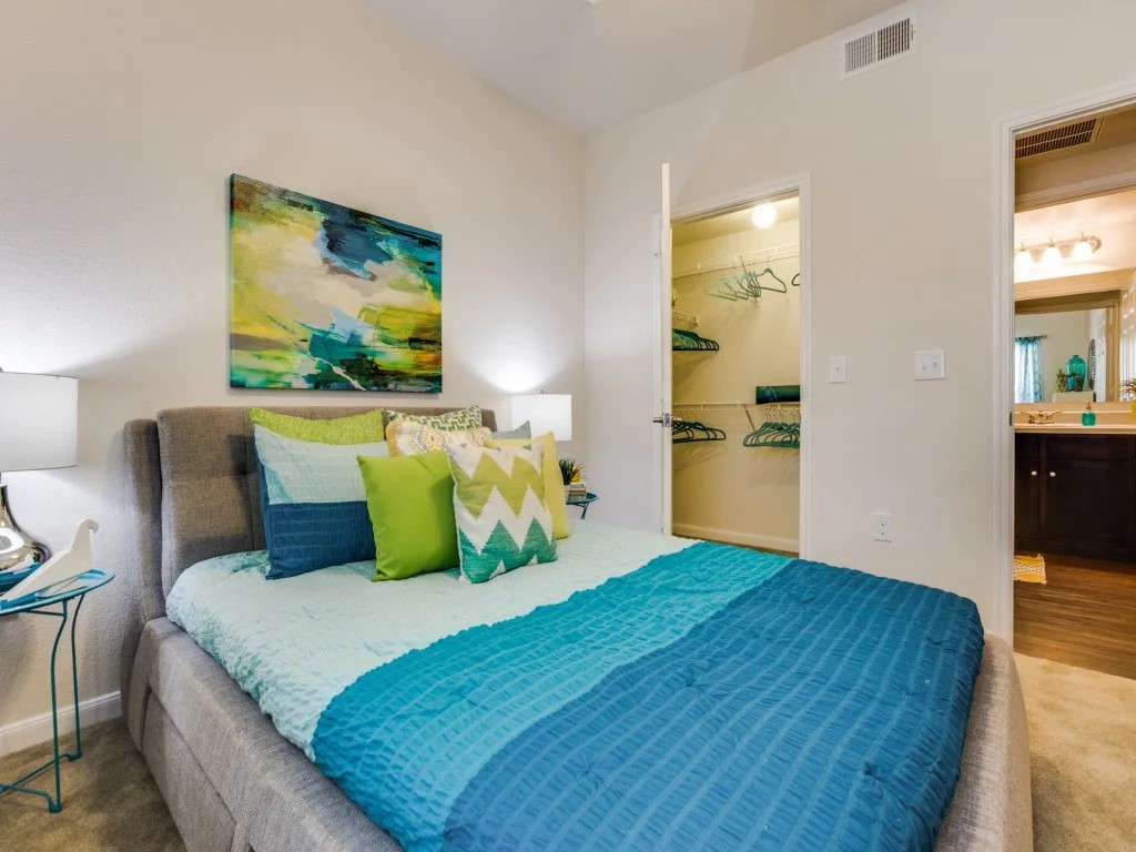 14722 Nacogdoches Road, Unit 4308 San Antonio, TX 78247 - Photo 4 of 22 a bedroom with a bed and painting on the wall